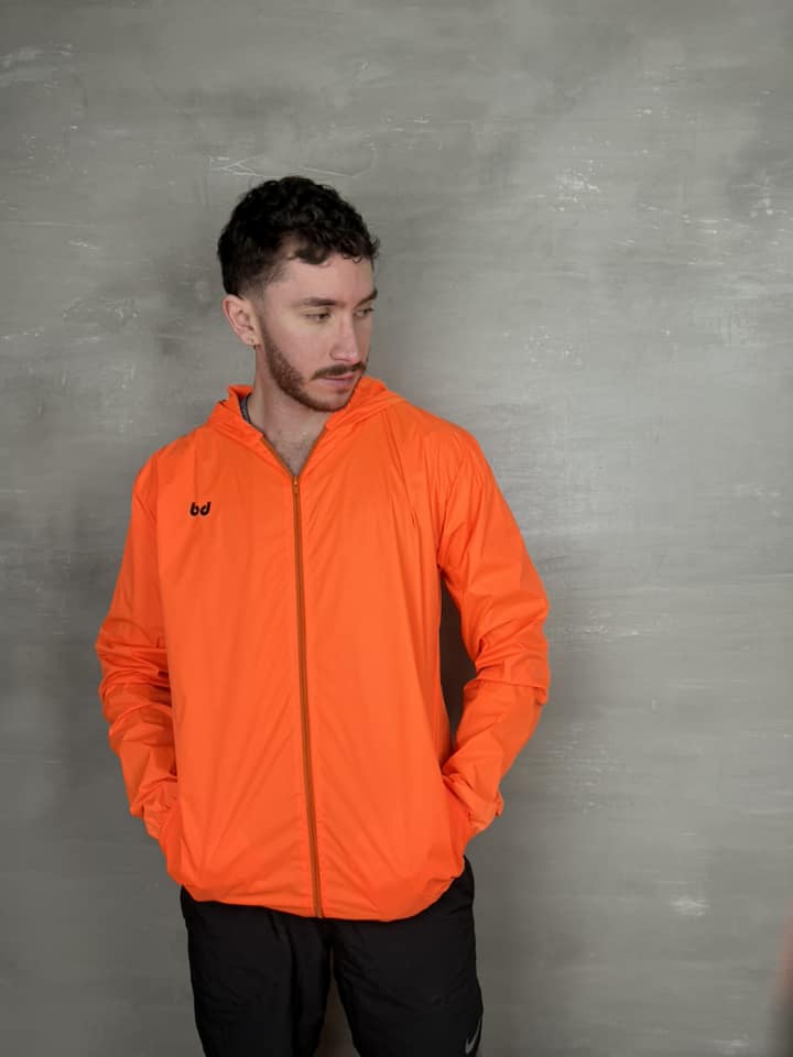 Chaqueta cortavientos unisex - Naranja Neón